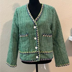 Vintage tweed fabric jacket with clover buttons and liner. Pristine condition!